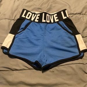 Blue black and white shorts with LOVE around waistband